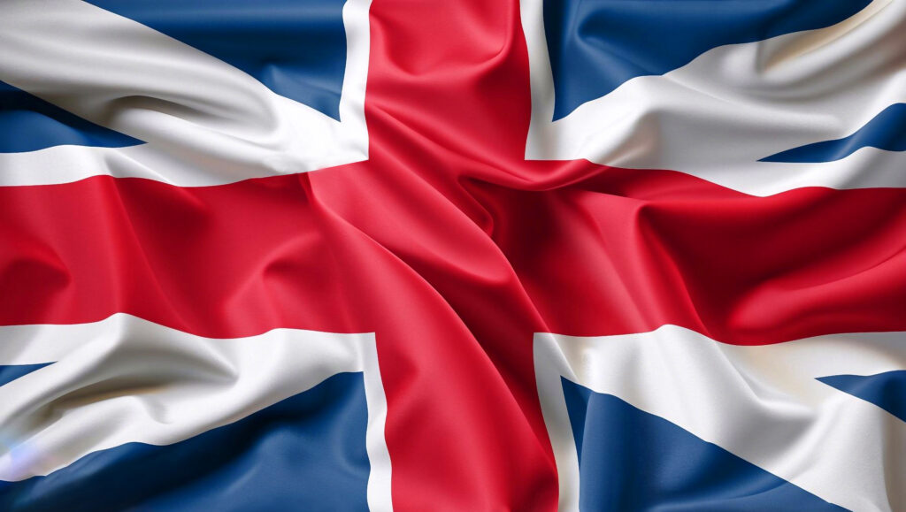 Grafika. Całe pole wypełnia flaga brytyjska: na niebieskim tle biały skośny krzyż a na nim prosty czerwony krzyż.